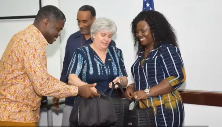 A screenshot from the YouTube channel of the U.S. Embassy in Ghana shows Ambassador Stephanie Sullivan, center, handing over Cellebrite technology to Gustav Yankson, left, director of the Ghana police cybercrime unit of the Criminal Investigation Department, and Maame Yaa Tiwaa Addo-Danquah, right, former director general of Ghana police CID.