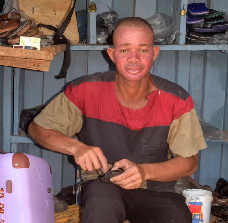Awambire Nyaaba Micuw "Ayellow" has built a livelihood around shoeshine and leather-related work at Bolgatanga Girls Senior High School